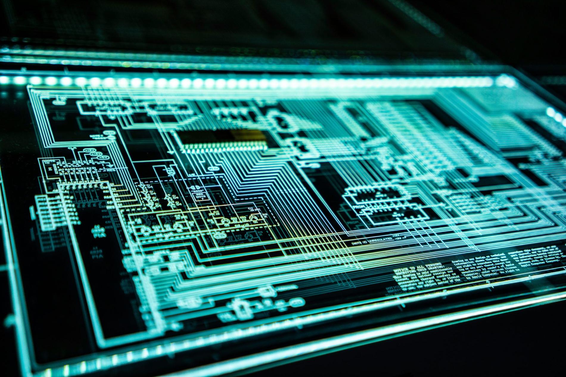 Futuristic glowing digital circuit board close-up