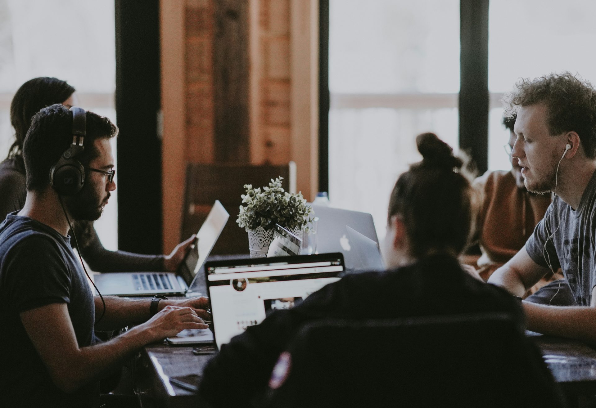 Group working on laptops in a meeting